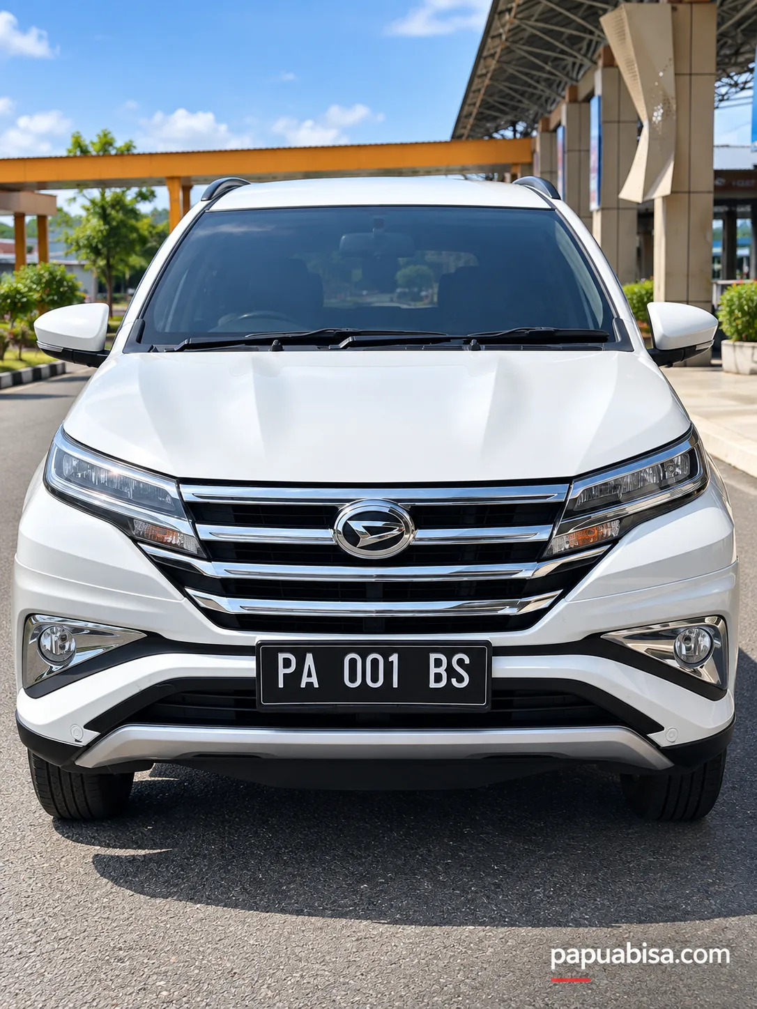 Unit Daihatsu putih di area drop-off